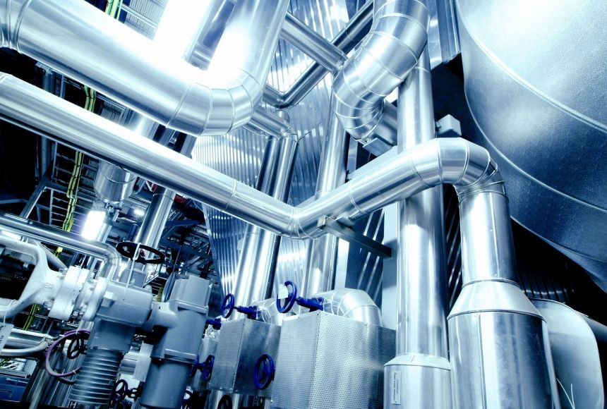 A close up of pipes and valves in a factory